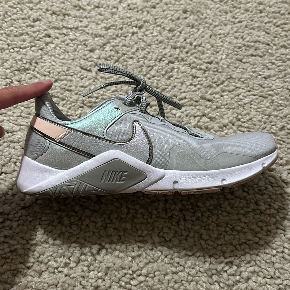 Nike women’s tennis shoes. Size 8. Grey w/iridescent grey and pink.